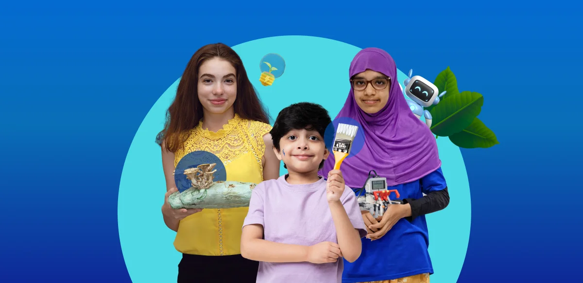 Una niña con un proyecto artístico, un niño con un pincel y otra niña con un pequeño robot.
